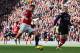 MANCHESTER, ENGLAND - NOVEMBER 03: Robin van Persie of Manchester United shoots at goal after an error by Thomas Vermaelen of Arsenal during the Barclays Premier League match between Manchester United and Arsenal at Old Trafford on November 3, 2012 in Manchester, England. (Photo by Alex Livesey/Getty Images)