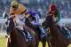 ARCADIA, CA - NOVEMBER 03: John Velazquez rides Wise Dan to win the Breeders' Cup Mile ahead of Rafael Bejarano on Animal Kingdom and Joseph O'Brien on Excelebration at Santa Anita Park on November 3, 2012 in Arcadia, California. (Photo by Harry How/Getty Images)