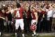 November 3, 2012; Baton Rouge, LA, USA; Alabama Crimson Tide defensive back Vinnie Sunseri (3) and running back T.J. Yeldon (4) celebrate with fans after defeating the LSU Tigers 21-17 at Tiger Stadium. Mandatory Credit: Crystal LoGiudice-US PRESSWIRE