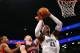 NEW YORK, NY - NOVEMBER 03: Gerald Wallace #45 of the Brooklyn Nets drives to the basket as Jonas Valanciunas #17 of the Toronto Raptors defends at the Barclays Center on November 3, 2012 in the Brooklyn borough of New York City. NOTE TO USER: User expressly acknowledges and agrees that, by downloading and/or using this photograph, user is consenting to the terms and conditions of the Getty Images License Agreement. (Photo by Alex Trautwig/Getty Images)