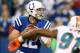 INDIANAPOLIS, IN - NOVEMBER 04: Andrew Luck #12 of the Indianapolis Colts gets ready to throw a first quarter pass while being rushed by Cameron Wake #91 of the Miami Dolphins at Lucas Oil Stadium on November 4, 2012 in Indianapolis, Indiana. (Photo by Gregory Shamus/Getty Images)