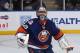 UNIONDALE, NY - OCTOBER 29: Rick DiPietro #39 of the New York Islanders makes a third period save and watches as the puck in his game against the San Jose Sharks at Nassau Veterans Memorial Coliseum on October 29, 2011 in Uniondale, New York. The Sharks defeated the Islanders 3-2 in overtime. (Photo by Bruce Bennett/Getty Images)