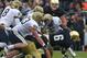 SOUTH BEND, IN - NOVEMBER 03: Theo Riddick #6 of the Notre Dame Fighting Irish is dropped for a loss by (L-R) Bryan Murphy #93, Joe Trebitz #53, Shane Gordon #44 and Shayne Hale #45 of the Pittsburgh Panthers at Notre Dame Stadium on November 3, 2012 in South Bend, Indiana. Notre Dame defeated Pittsburgh 29-23 in triple overtime. (Photo by Jonathan Daniel/Getty Images)