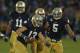 SOUTH BEND, IN - OCTOBER 20: Danny Spond #13 of the Notre Dame Fighting Irish celebrates with teammates including Ishaq Williams #11 and Manti T'eo #5 after intercepting a pass on the next to last play of the game against the BYU Cougars at Notre Dame Stadium on October 20, 2012 in South Bend, Indiana. Notre Dame defeated BYU 17-14. (Photo by Jonathan Daniel/Getty Images)
