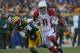GREEN BAY, WI - NOVEMBER 04: Larry Fitzgerald #11 of the Arizona Cardinals breaks away from Tramon Williams #38 of the Green Bay Packers on his way to scoring a touchdown at Lambeau Field on November 4, 2012 in Green Bay, Wisconsin. The Packers defeated the Cardinals 31-17. (Photo by Jonathan Daniel/Getty Images)
