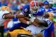 GAINESVILLE, FL - OCTOBER 06: Tharold Simon #24 of the LSU Tigers tackles Jeff Driskel #6 of the Florida Gators during the game at Ben Hill Griffin Stadium on October 6, 2012 in Gainesville, Florida. (Photo by Sam Greenwood/Getty Images)