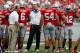 COLUMBUS, OH - SEPTEMBER 1: Head Coach Urban Meyer of the Ohio State Buckeyes watches a reply while meeting with members of his defense during a timeout on September 1, 2012 at Ohio Stadium in Columbus, Ohio. Ohio State defeated Miami 56-10. (Photo by Kirk Irwin/Getty Images)