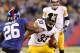 EAST RUTHERFORD, NJ - NOVEMBER 04: Isaac Redman #33 of the Pittsburgh Steelers tries to dodge Antrel Rolle #26 of the New York Giants during their game at MetLife Stadium on November 4, 2012 in East Rutherford, New Jersey. (Photo by Jeff Zelevansky/Getty Images)