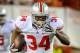 LINCOLN, NE - OCTOBER 8: Running back Carlos Hyde #34 of the Ohio State Buckeyes runs past linebacker Lavonte David #4 of the Nebraska Cornhuskers during their game at Memorial Stadium October 8, 2011 in Lincoln, Nebraska. Nebraska Defeated Ohio State 34-27. (Photo by Eric Francis/Getty Images)