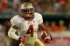 MIAMI GARDENS, FL - OCTOBER 20: Chris Thompson #4 of the Florida State Seminoles rushes during a game against the Miami Hurricanes at Sun Life Stadium on October 20, 2012 in Miami Gardens, Florida. (Photo by Mike Ehrmann/Getty Images)