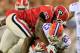 JACKSONVILLE, FL - OCTOBER 27: Jordan Jenkins #59 of the Georgia Bulldogs tackles Mike Gillislee #23 of the Florida Gators during the game at EverBank Field on October 27, 2012 in Jacksonville, Florida. (Photo by Sam Greenwood/Getty Images)