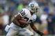 SEATTLE, WA - AUGUST 30: Running back Taiwan Jones #22 of the Oakland Raiders rushes against the Seattle Seahawks at CenturyLink Field on August 30, 2012 in Seattle, Washington. (Photo by Otto Greule Jr/Getty Images)