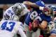 ARLINGTON, TX - OCTOBER 28: Bear Pascoe #86 of the New York Giants fumbles the ball under pressure from Bruce Carter #54 of the Dallas Cowboys, Dan Connor #52 of the Cowboys and Gerald Sensabaugh #43 of the Cowboys at Cowboys Stadium on October 28, 2012 in Arlington, Texas. (Photo by Tom Pennington/Getty Images)