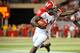 LINCOLN, NE - SEPTEMBER 29: Running back Montee Ball #28 of the Wisconsin Badgers stiff arms safety P.J. Smith #13 of the Nebraska Cornhuskers during their game at Memorial Stadium on September 29, 2012 in Lincoln, Nebraska. (Photo by Eric Francis/Getty Images)