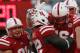 Nov 10, 2012; Lincoln, NE, USA; Nebraska Cornhuskers running back Imani Cross (32) is congratulated after scoring a touchdown by C.J. Zimmerer (31) and Brent Qvale (76) against the Penn State Nittany Lions at Memorial Stadium in the second half. Nebraska won 32-23. Mandatory Credit: Bruce Thorson-US PRESSWIRE