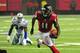 ATLANTA, GA - NOVEMBER 4: Julio Jones #11 of the Atlanta Falcons runs with a catch against DeMarcus Ware #94 of the Dallas Cowboys at the Georgia Dome on November 4, 2012 in Atlanta, Georgia. The Falcons defeated the Cowboys 19-13. (Photo by Scott Cunningham/Getty Images)