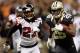 NEW ORLEANS, LA - NOVEMBER 11: Chris Ivory #29 of the New Orleans Saints runs past Dunta Robinson #23 of the Atlanta Falcons to score a touchdown at The Mercedes-Benz Superdome on November 11, 2012 in New Orleans, Louisiana. (Photo by Chris Graythen/Getty Images)