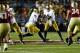 CHESTNUT HILL, MA - NOVEMBER 10: Everett Golson #5 of the Notre Dame Fighting Irish hands the ball off to teammate Theo Riddick #6 against the Boston College Eagles during the game on November 10, 2012 at Alumni Stadium in Chestnut Hill, Massachusetts. (Photo by Jared Wickerham/Getty Images)
