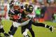 TAMPA, FL - AUGUST 24: Defensive back Ronde Barber #20 of the Tampa Bay Buccaneers #20 tackles tight end Aaron Hernendez #81 of the New England Patriots at Raymond James Stadium in a pre-season game August 24, 2012 in Tampa, Florida. (Photo by Al Messerschmidt/Getty Images)