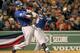 BOSTON, MA - APRIL 18: Mike Napoli #25 of the Texas Rangers connects for a two-run double in the 8th inning against the Boston Red Sox at Fenway Park April 18, 2012 in Boston, Massachusetts. (Photo by Jim Rogash/Getty Images)