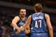 Nov 5, 2012; Dallas, TX, USA; Minnesota Timberwolves center Nikola Pekovic (14) celebrates with forward Andrei Kirlenko (47) after a basket and foul against the Dallas Mavericks at American Airlines Center. Mandatory Credit: Matthew Emmons-US PRESSWIRE
