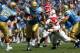 PASADENA, CA - SEPTEMBER 27: Khalil Bell #36 of the UCLA Bruins runs away from a tackle by Ben Jacobs #54 of the Frenso State Bulldogs during the game on September 27, 2008 at the Rose Bowl in Pasadena, California. (Photo by Stephen Dunn/Getty Images)