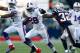 FOXBORO, MA - NOVEMBER 11: C.J. Spiller #28 of the Buffalo Bills runs with the ball around Devin McCourty #32 of the New England Patriots during the game on November 11, 2012 at Gillette Stadium in Foxboro, Massachusetts. (Photo by Jared Wickerham/Getty Images)
