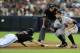 PHOENIX, AZ - SEPTEMBER 16: Brandon Belt #9 of the San Francisco Giants waits for a throw as Adam Eaton #6 of the Arizona Diamondbacks dives back to first base at Chase Field on September 16, 2012 in Phoenix, Arizona. (Photo by Norm Hall/Getty Images)