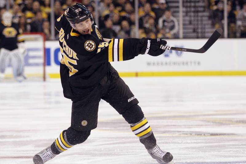 BOSTON, MA - DECEMBER 19: Johnny Boychuk #55 of the Boston Bruins takes the shot against the Montreal Canadiens at the TD Garden on December 19, 2011 in Boston, Massachusetts. (Photo by Bruce Bennett/Getty Images)