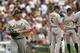 CHICAGO, IL - AUGUST 12: Starting pitcher Bartolo Colon #21 of the Oakland Athletics walks to the dugout after being taken out of the game against the Chicago White Sox by manager Bob Melvin #6 in the 6th inning at U.S. Cellular Field on August 12, 2012 in Chicago, Illinois. (Photo by Jonathan Daniel/Getty Images)