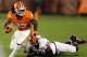 CLEMSON, SC - NOVEMBER 17: Andre Ellington #23 of the Clemson Tigers runs away from Brian Slay #55 of the North Carolina State Wolfpack during their game at Memorial Stadium on November 17, 2012 in Clemson, South Carolina. (Photo by Streeter Lecka/Getty Images)