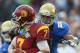 PASADENA, CA - NOVEMBER 17: Quarterback Matt Barkley #7 of the USC Trojans is sacked by linebacker Anthony Barr #11 of the UCLA Bruins in the second half at the Rose Bowl on November 17, 2012 in Pasadena, California. UCLA defeated USC 38-28. (Photo by Jeff Gross/Getty Images)