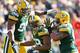 GREEN BAY, WI - OCTOBER 28: Mike Neal #96 Brad Jones #59 and Jerel Worthy #99 of the Green Bay Packers celebrate during the NFL game against the Jacksonville Jaguars at Lambeau Field on October 28, 2012 in Green Bay, Wisconsin. (Photo by Andy Lyons/Getty Images)