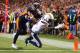 November 18, 2012; Denver, CO, USA; San Diego Chargers wide receiver Danario Alexander (84) catches a touchdown pass over Denver Broncos cornerback Tony Carter (32) during the fourth quarter at Sports Authority Field at Mile High. The Broncos won 30-23. Mandatory Credit: Chris Humphreys-US PRESSWIRE