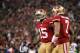 November 19, 2012; San Francisco, CA, USA; San Francisco 49ers wide receiver Michael Crabtree (15) is congratulated by quarterback Colin Kaepernick (7) after catching a touchdown pass against the Chicago Bears in the third quarter at Candlestick Park. The 49ers defeated the Bears 32-7. Mandatory Credit: Cary Edmondson-US PRESSWIRE