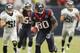 HOUSTON, TX - NOVEMBER 18: Andre Johnson #80 of the Houston Texans scores on a 48 yard reception in overtime against the Jacksonville Jaguars at Reliant Stadium on November 18, 2012 in Houston, Texas. Houston won 43-37 in overtime.(Photo by Bob Levey/Getty Images)