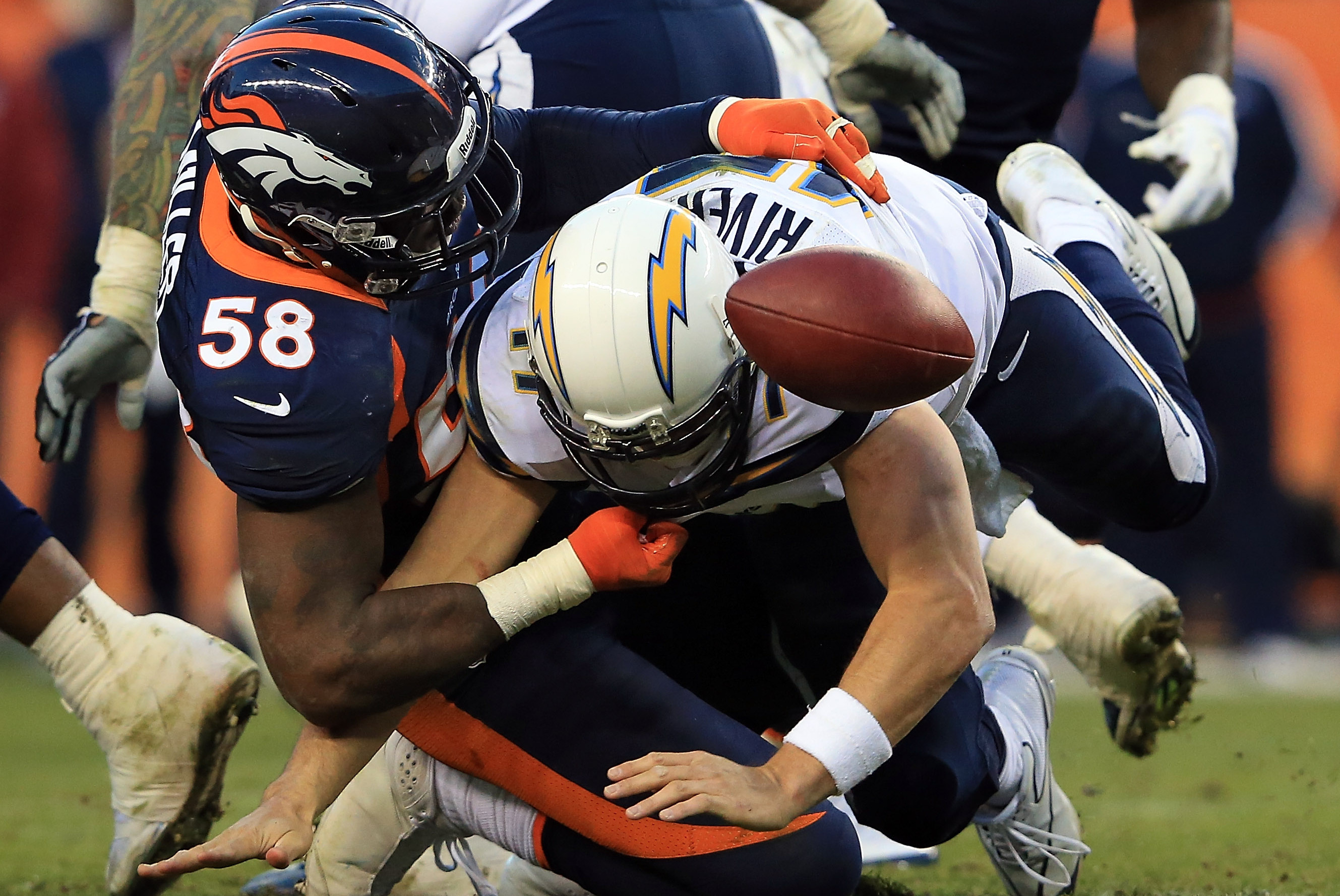 Von Miller (58) enters the field before the first half against the