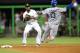 Aug 11, 2012; Miami, FL, USA; Miami Marlins shortstop Jose Reyes (7) turns the double play to force out Los Angeles Dodgers third baseman Hanley Ramirez (13) at second base during the third inning at Marlins Park. Mandatory Credit: Steve Mitchell-US PRESSWIRE