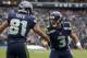 SEATTLE, WA - NOVEMBER 04: Golden Tate #81, of the Seattle Seahawks celebrates a touchdown with teammate Russell Wilson #3 during a game against the Minnesota Vikings at CenturyLink Field on November 4, 2012 in Seattle, Washington. (Photo by Stephen Brashear/Getty Images)