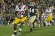 SOUTH BEND, IN - OCTOBER 22: Randall Telfer #82 of the University of Southern California Trojans celebrates a touchdown catch in front of Carlo Calabrese #44 of the Notre Dame Fighting Irish at Notre Dame Stadium on October 22, 2011 in South Bend, Indiana. USC defeated Notre Dame 31-17. (Photo by Jonathan Daniel/Getty Images)