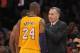 Nov 20, 2012; Los Angeles, CA, USA; Los Angeles Lakers coach Mike D'Antoni (right) talks with guards Kobe Bryant (24) and Chris Duhon (21) during the game against the Brooklyn Nets at the Staples Center. The Lakers defeated the Nets 95-90. Mandatory Credit: Kirby Lee/Image of Sport-US PRESSWIRE