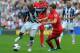 WEST BROMWICH, ENGLAND - AUGUST 18: Joe Allen of Liverpool battles Youssouf Mulumbu of West Brom during the Barclays Premier League match between West Bromwich Albion and Liverpool at The Hawthorns on August 18, 2012 in West Bromwich, England. (Photo by Michael Regan/Getty Images)