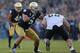 SOUTH BEND, IN - NOVEMBER 17: Manti T'eo #5 of the Notre Dame Fighting Irish moves around Whit Barnes #60 of the Wake Forest Demon Deacons at Notre Dame Stadium on November 17, 2012 in South Bend, Indiana. Notre Dame defeated Wake Forest 38-0. (Photo by Jonathan Daniel/Getty Images)