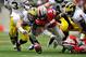 COLUMBUS, OH - NOVEMBER 24: Desmond Morgan #48 of the Michigan Wolverines and Corey Brown #3 of the Ohio State Buckeyes dive for a loose ball after Corey Brown #10 of the Ohio State Buckeyes fumbled a punt return at Ohio Stadium on November 24, 2012 in Columbus, Ohio. Michigan recovered the ball and scored a touchdown. (Photo by Jamie Sabau/Getty Images)