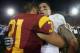 LOS ANGELES, CA - NOVEMBER 24: Linebacker Manti Te'o #5 of the Notre Dame Fighting Irish is congratulated by fullback Soma Vainuku #31 of the USC Trojans at Los Angeles Memorial Coliseum on November 24, 2012 in Los Angeles, California. Notre Dame defeated USC Trojans 22-13. (Photo by Jeff Gross/Getty Images)