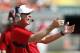 MIAMI GARDENS, FL - SEPTEMBER 29: Head Coach Tom O'Brien of the North Carolina State Wolfpack calls to the players prior to a play against the Miami Hurricanes on September 29, 2012 at Sun Life Stadium in Miami Gardens, Florida. The Hurricanes defeated the Wolfpack 44-37. (Photo by Joel Auerbach/Getty Images)