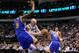 Nov 19, 2012; Dallas, TX, USA; Dallas Mavericks center Chris Kaman (35) drives the ball past Golden State Warriors center Festus Ezeli (31) and small forward Harrison Barnes (40) during the first quarter at the American Airlines Center. Mandatory Credit: Jerome Miron-US PRESSWIRE