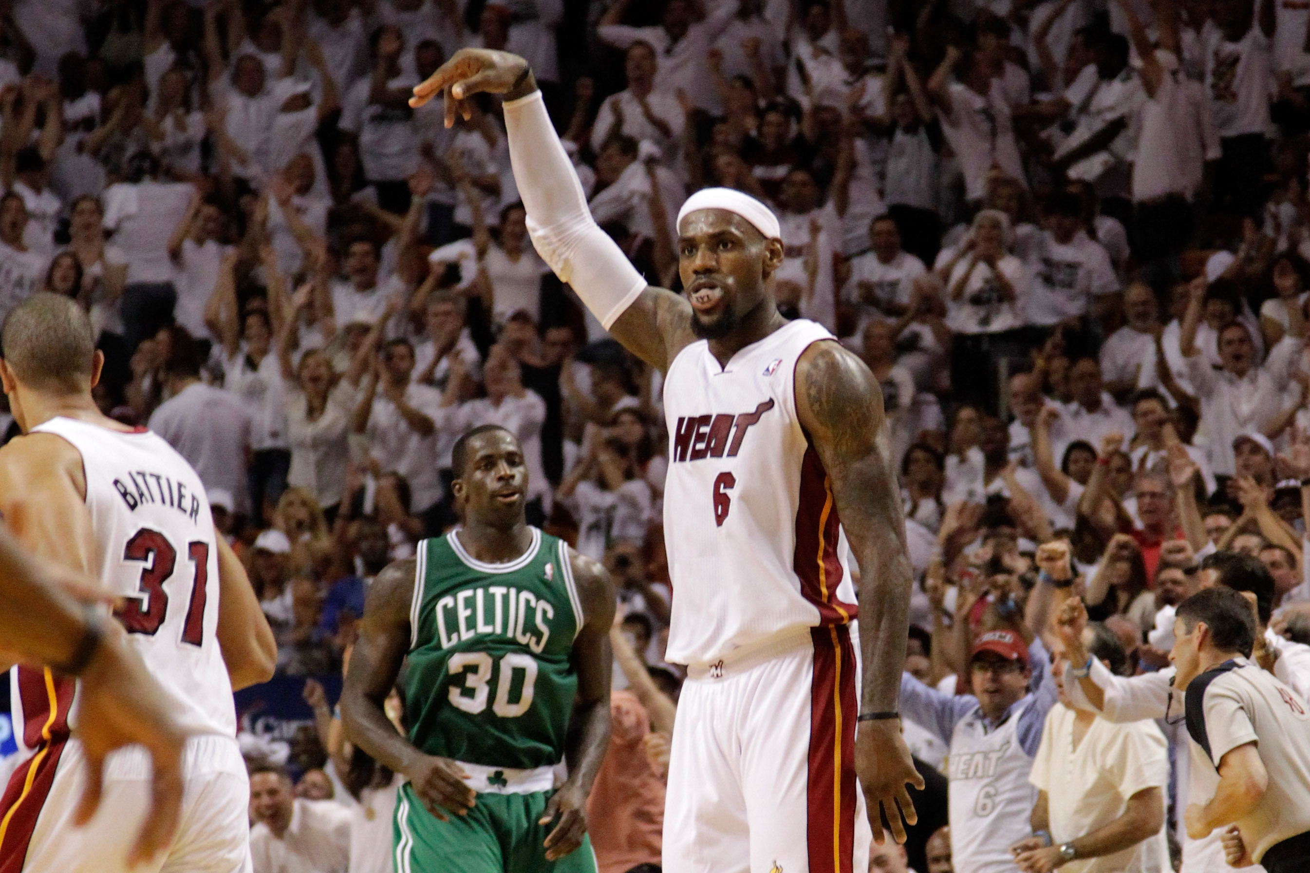 Miami Heat's head coach Spoelstra talks with LeBron James in the pre-game huddle before the start of their NBA game against the Washington Wizards in Miami Photo #124279