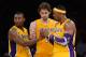 LOS ANGELES, CA - NOVEMBER 16: Metta World Peace #15 and Pau Gasol #16 of the Los Angeles Lakers help Dwight Howard #12 with his contact lens during the basketball game against Phoenix Suns at Staples Center on November 16, 2012 in Los Angeles, California. NOTE TO USER: User expressly acknowledges and agrees that, by downloading and or using this photograph, User is consenting to the terms and conditions of the Getty Images License Agreement. (Photo by Kevork Djansezian/Getty Images)
