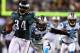 PHILADELPHIA, PA - NOVEMBER 26: Bryce Brown #34 of the Philadelphia Eagles carries the ball in for a touchdown as Sherrod Martin #23 of the Carolina Panthers defends on November 26, 2012 at Lincoln Financial Field in Philadelphia, Pennsylvania. (Photo by Elsa/Getty Images)